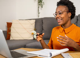 Employee talking in front of laptop