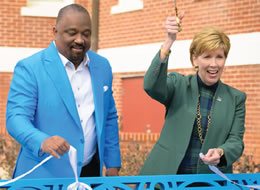 Virgil cutting a ribbon at a ceremony